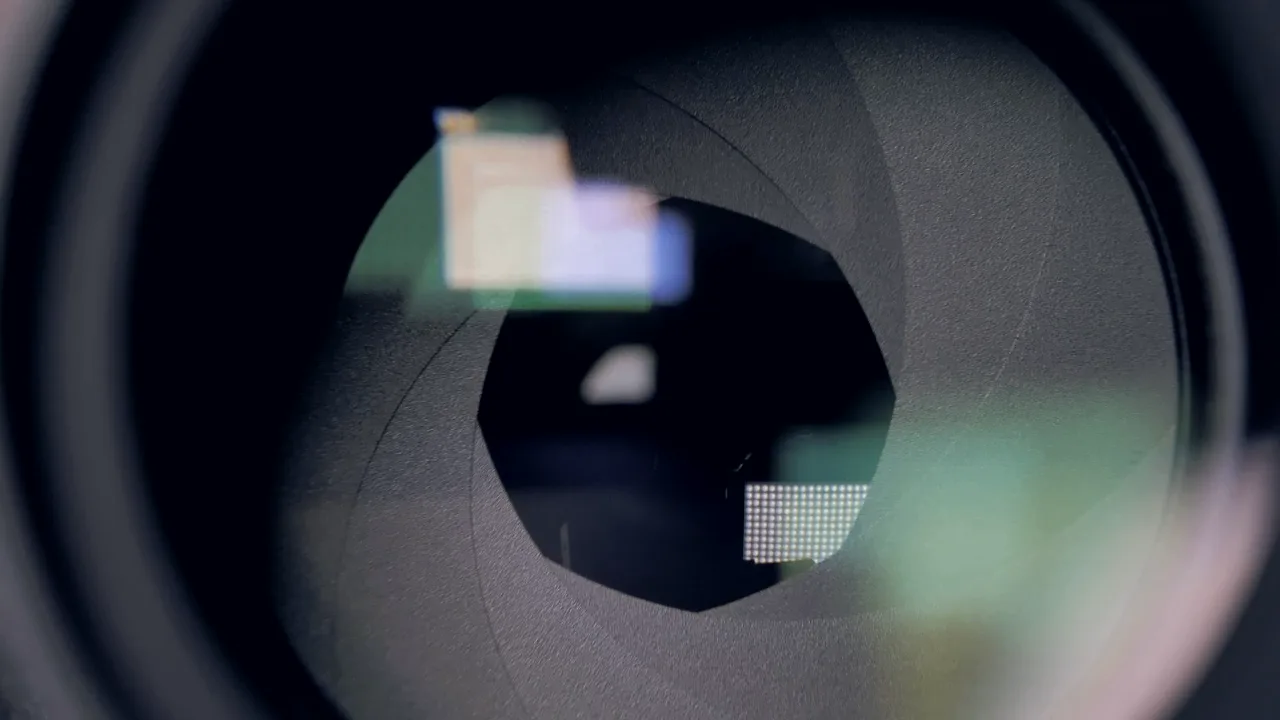 Close-up of a camera aperture opening and closing