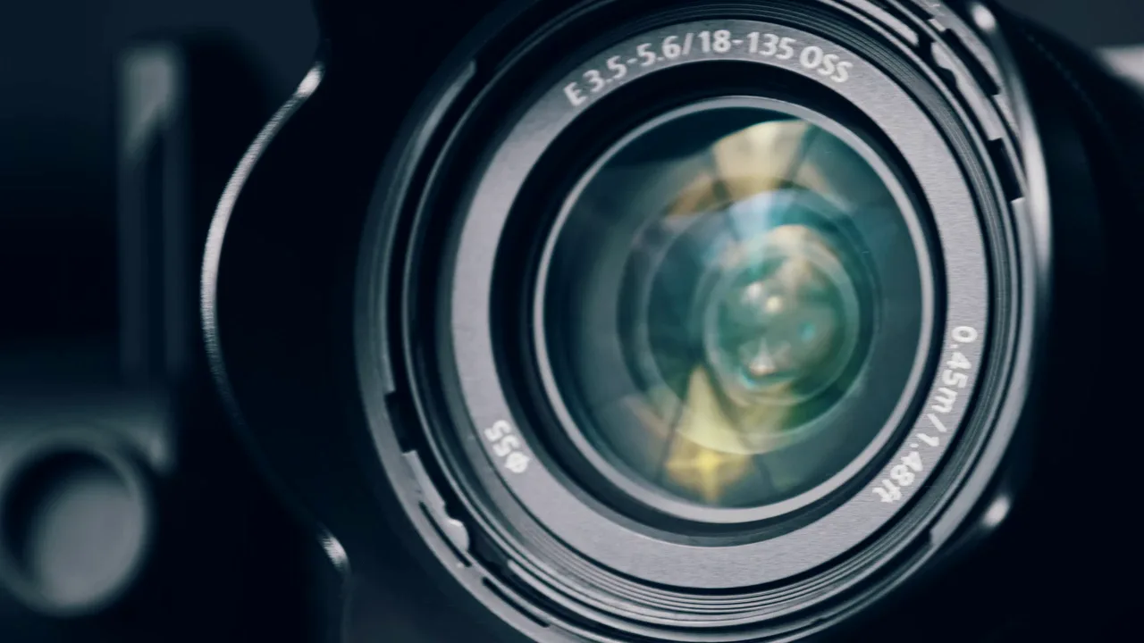 Close-up of a camera lens with reflections