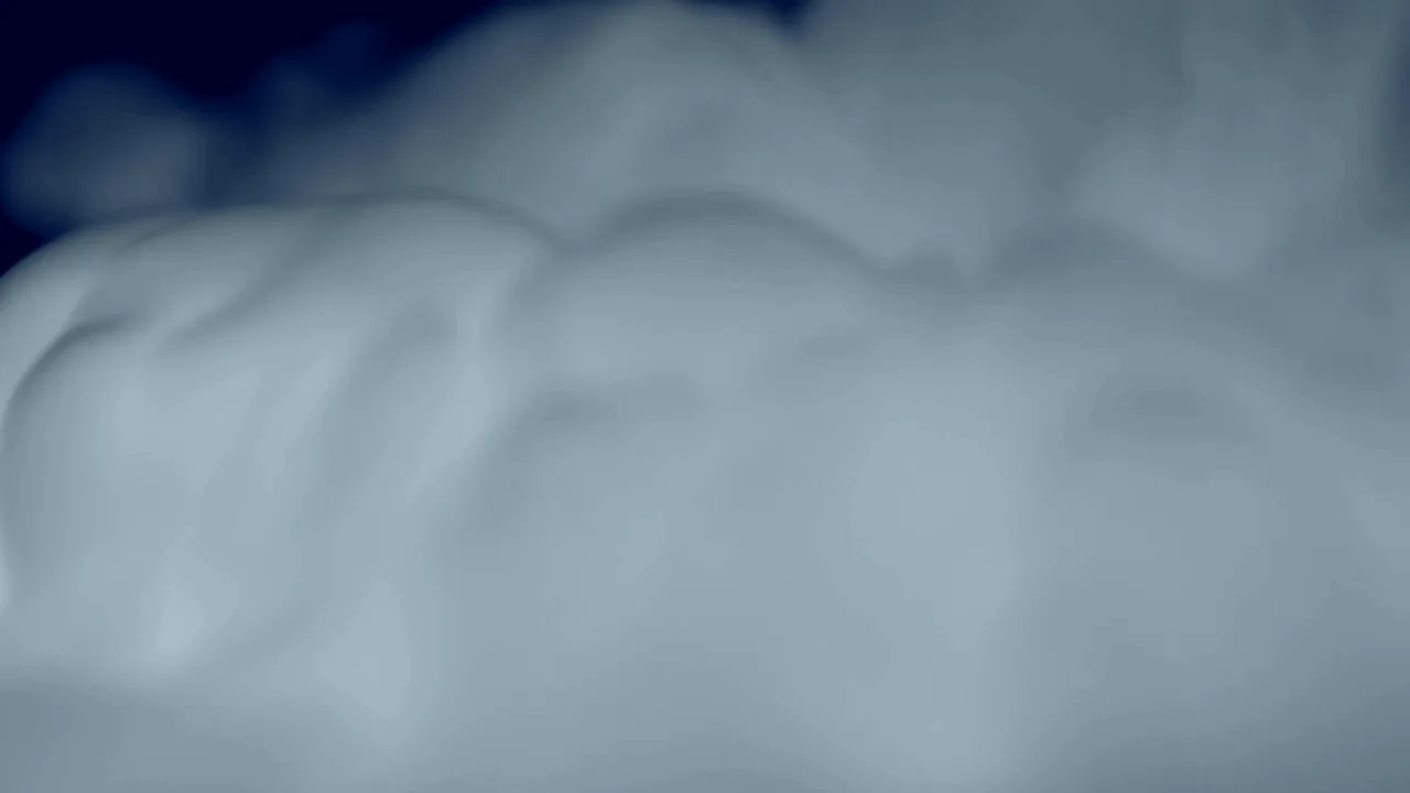 Cold blue mist rolling across the frame